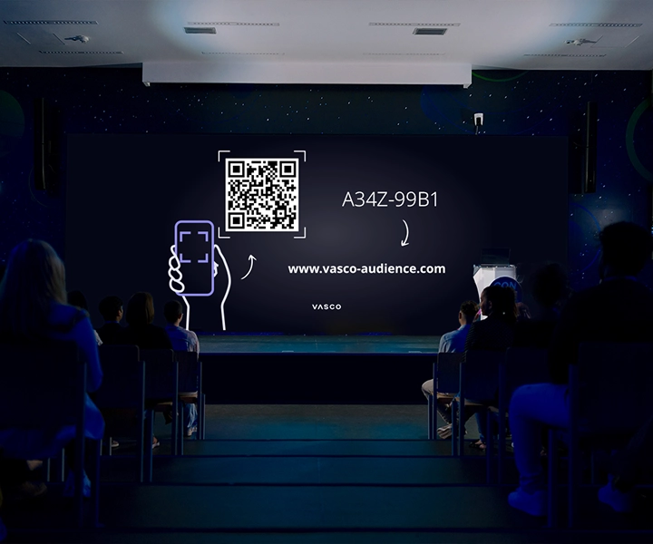 Na velikom ekranu konferencijske sobe prikazuju se upute „Pridružite se Vasco Audience“ s uputama za sudionike o tome kako pristupiti sesiji.